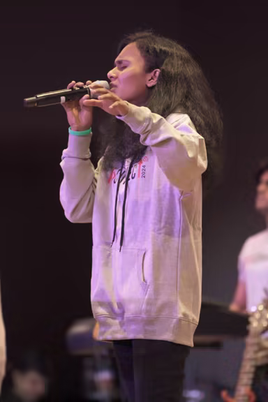 Student musician serving on the worship team