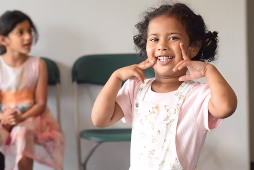 Child smiling during an ICPF Canada community gathering
